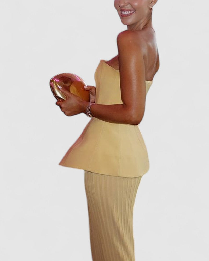 Noemi’s Strapless Maxi Dress with Flowing Silhouette and Elegant Design