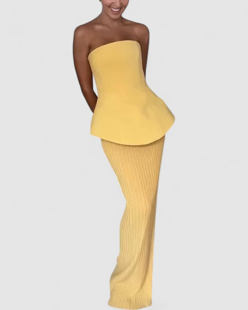 Noemi’s Strapless Maxi Dress with Flowing Silhouette and Elegant Design