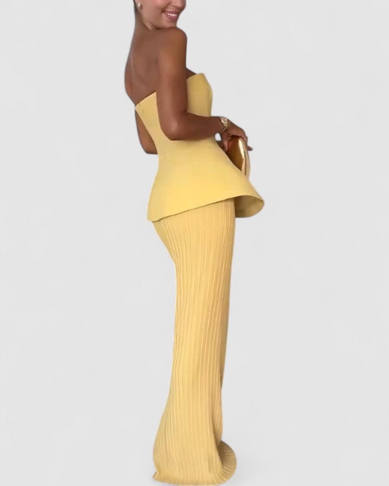 Noemi’s Strapless Maxi Dress with Flowing Silhouette and Elegant Design